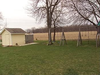 Backyard and There are 2 sheds.