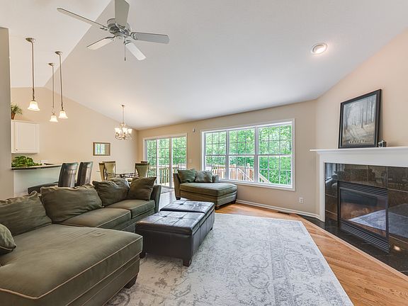 Architecturally interesting lines, wall of windows, gorgeous fireplace and wood floors add to the ambiance of this stunning home.