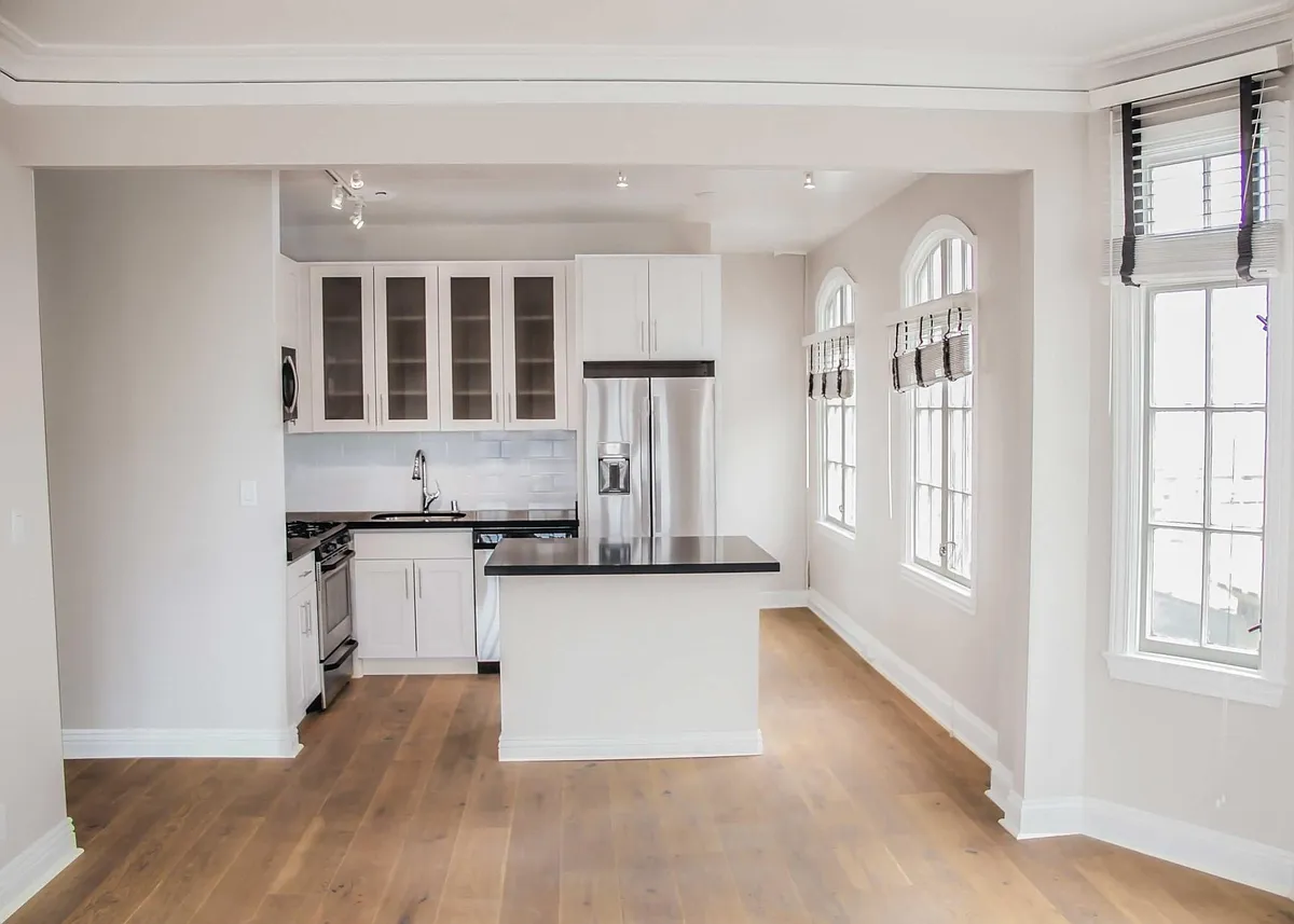 Nob Hill Place ~ Newly renovated residences! Open kitchen layout with kitchen island, elegant quartz counters, designer wood like flooring, custom white cabinetry, stainless steel appliances, dishwasher, built in microwave, gas stove, track lighting, nat - Nob Hill Place