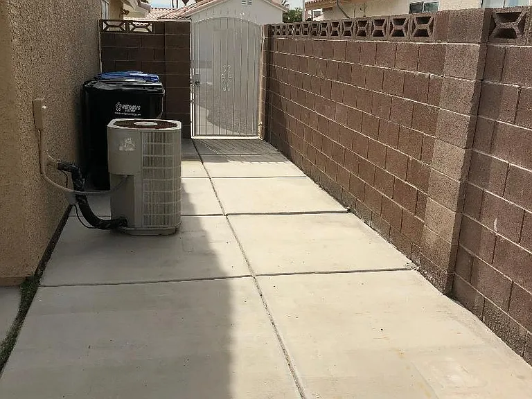 Gated backyard - west side view.