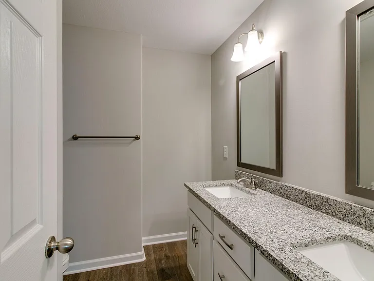 Primary Full Bathroom Upstairs with Double Vanities and LVP Flooring