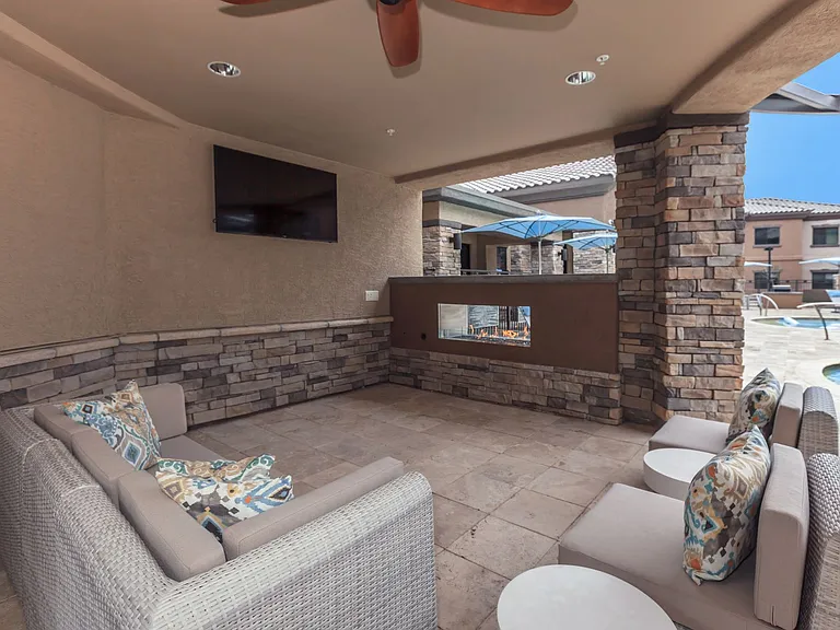 Poolside lounge with outdoor TVs