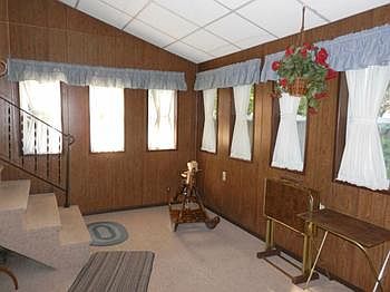Sunroom off kitchen measures 9x15'