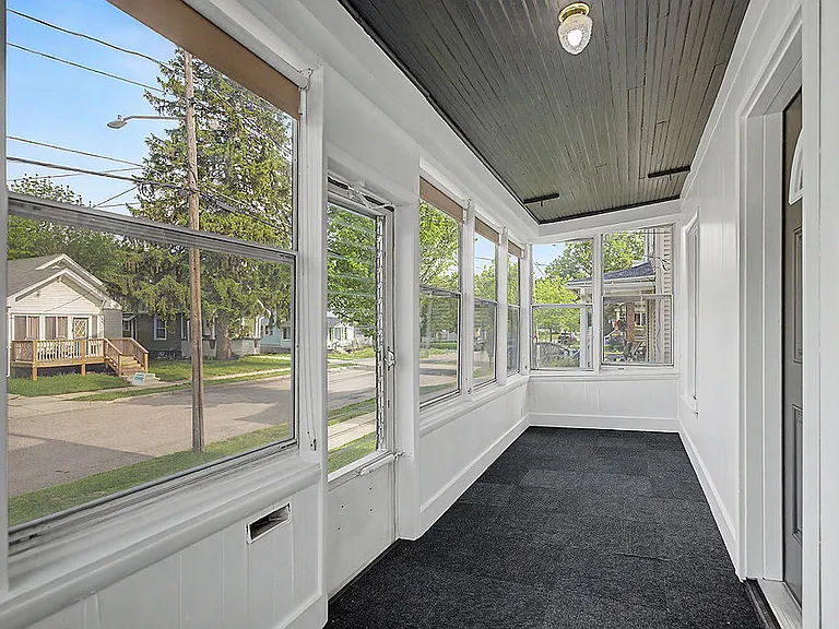 Enclosed front porch for relaxing year round
