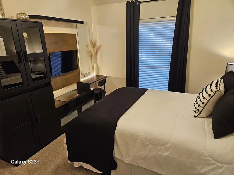 2nd Bedroom with built-in desk with tons of storage, Queen bed and included TV, and new pillows and linens
