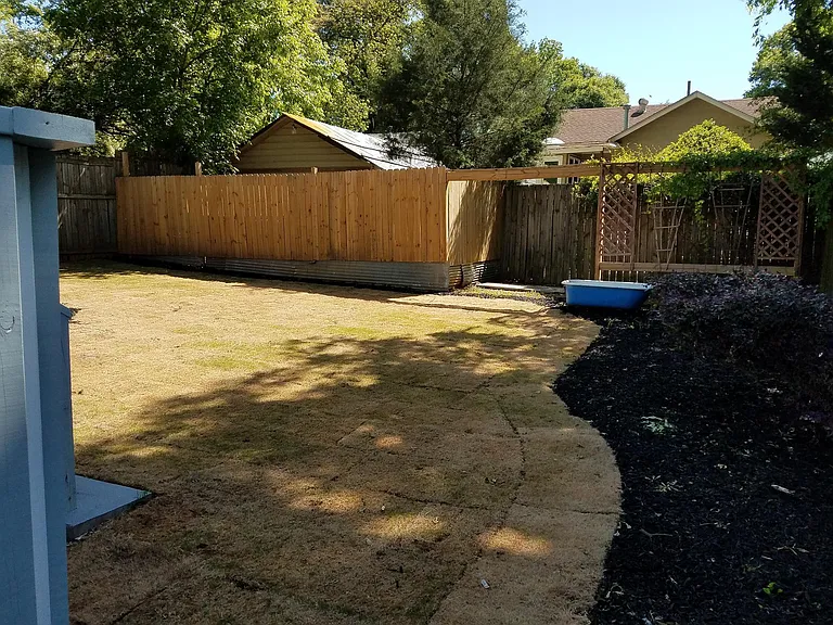 At the front, right side of backyard