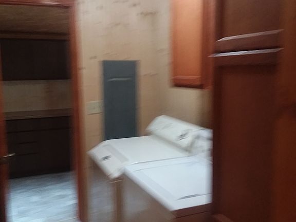 W/D area with closet & cupboard
