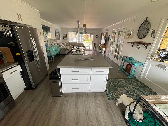Kitchen open to LR & patio view