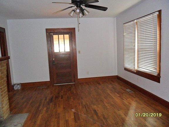 Living room view 3 with door to screened porch