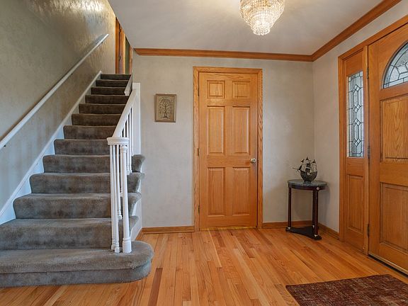 Large & Open hardwood foyer with walk-in closet