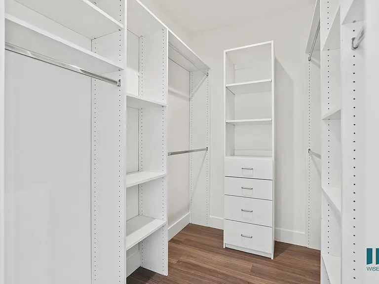 Walk-In Closet with Built-In Organizers and Shelving