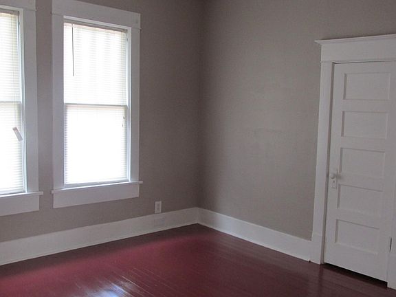 Bedroom with closet door showing...full length mirror