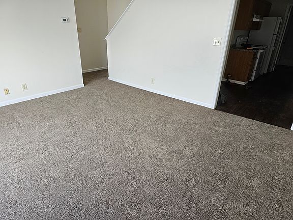 Living Room stairs lead to upstairs bedroom
