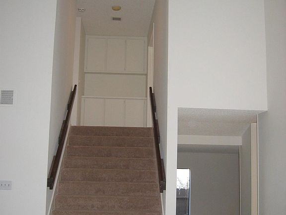 Majestic staircase leads to upstairs bedrooms