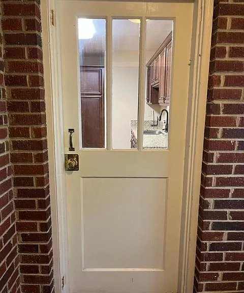 View from washer/dryer looking into kitchen.