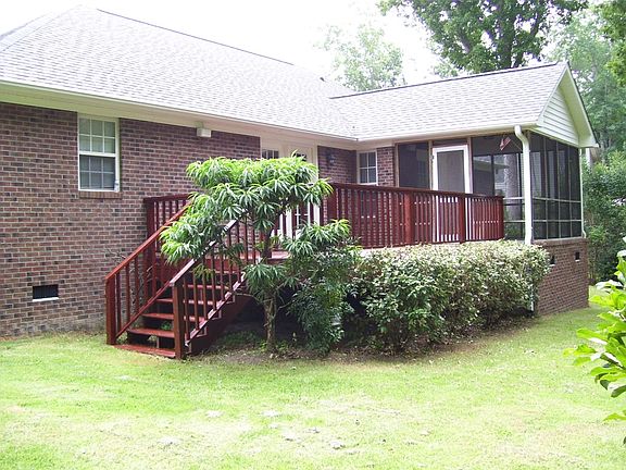 Screen porch and deck with private fenced yard