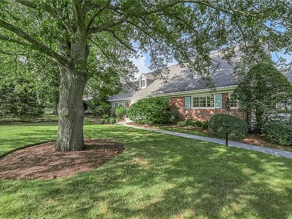The mature vegetation in the front yard provides privacy and character to the property