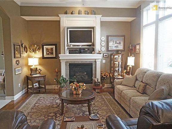 Open living room that merges with the kitchen. Beautiful Fireplace with new Hardwood floors