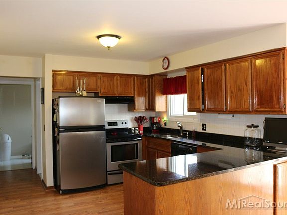 Generous Kitchen with Ample Cabinets and counter space. Granite counters, Stainless appliances inclu