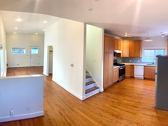 Open Modern Floorplan with Abundant Light and Natural Wood