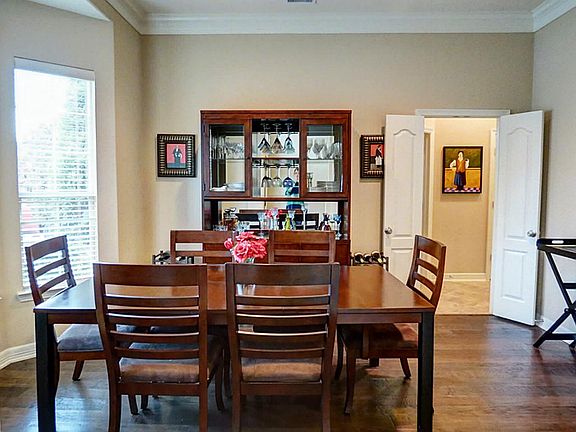 Very light and bright dining room with bay window and wood floors. Easy access to the kitchen