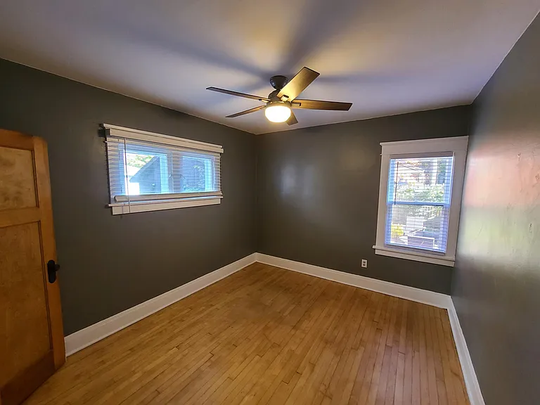 Bedroom 2 with two big windows. Both bedrooms with new ceiling fans.