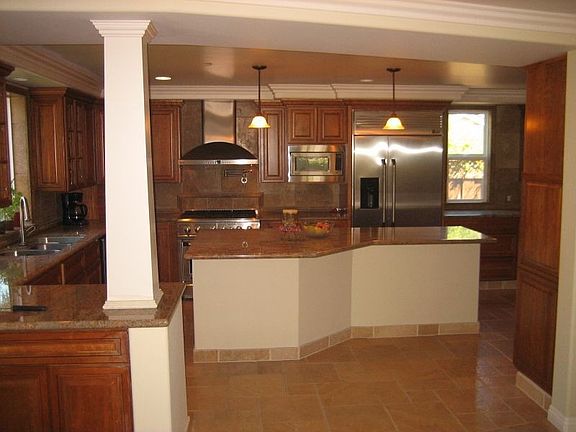 Gourmet kitchen with custom cabinets/granite/travertine flooring