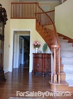Foyer 2
						:
						Curved oak staircase in two-story foyer.