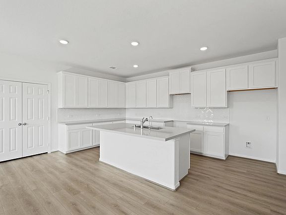 Beautifully designed kitchen with a spacious pantry, combining style and functionality for an organi