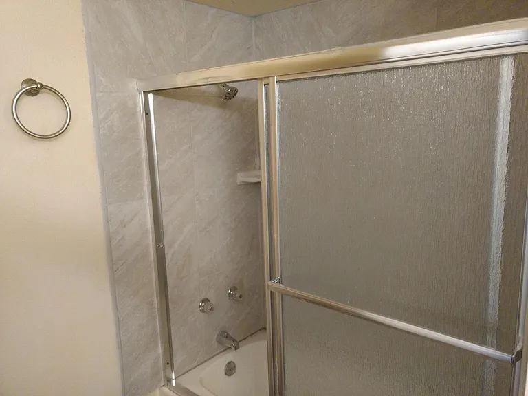 New tile and shower enclosure.