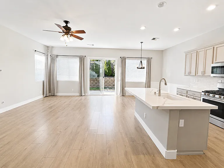 Second living room, dining area, and kitchen