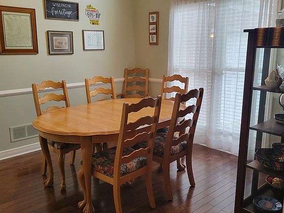 Separate dining area which opens to kitchen, living room and entry.