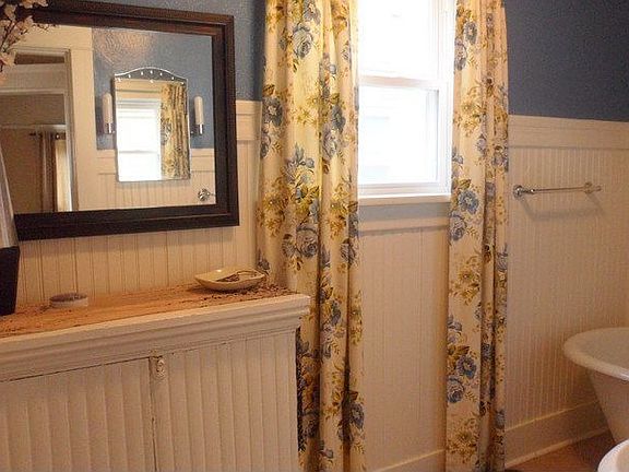 Bathroom on Main floor.  Tiled floor and clawfoot tub with shower