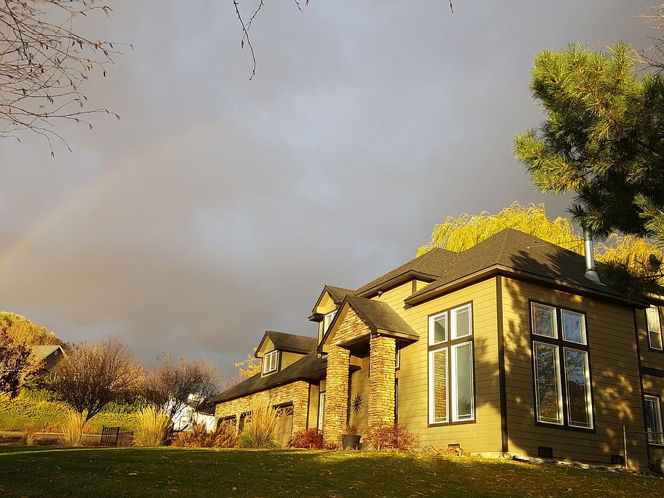 Rainbow over home in Fall