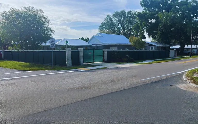 Charming corner property with gated privacy.
