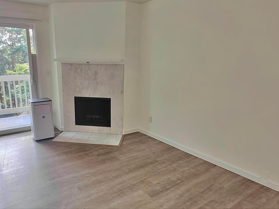 Living Room with Fireplace and a Private Balcony