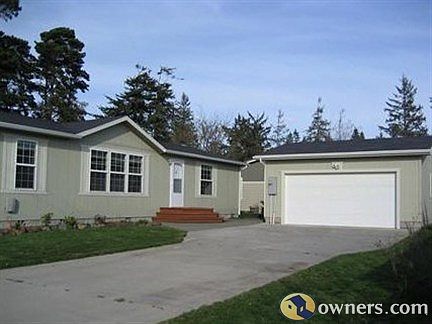 Enter Photo CaptioHedge On Street & fenced for privacy