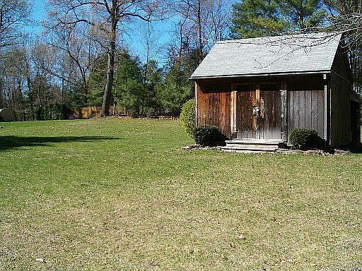 Shed, view from edge of adjacent wooded lot