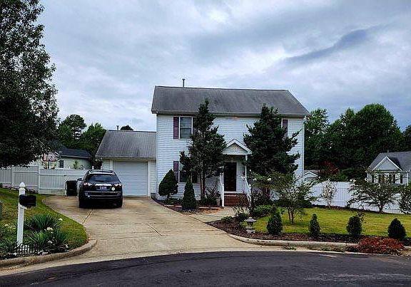 Enough space to park many cars around the entire house.
