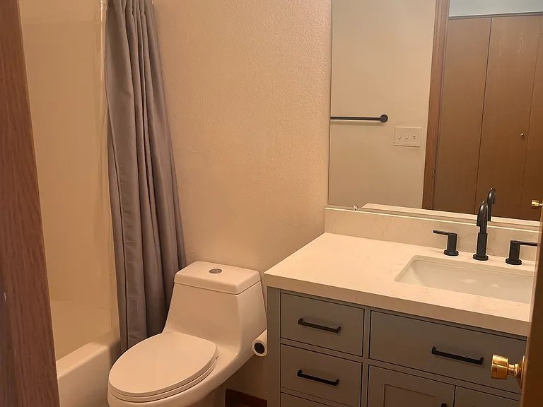 Downstairs bathroom with new vanity, hardware, and toilet