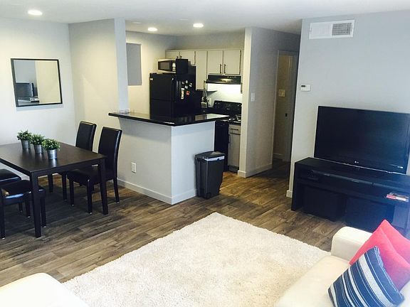 View of Dining Room, Kitchen, and Hallway from Couch.