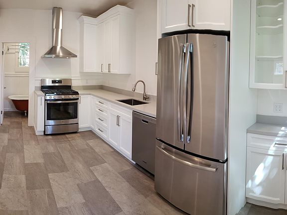 Kitchen with premium appliances, quartz counters, lots of storage space