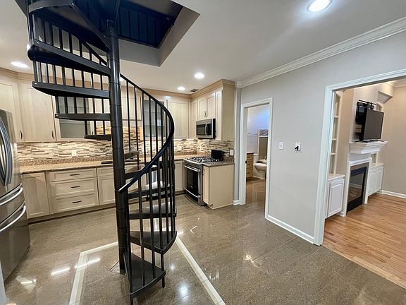 Kitchen connected to dining area & living room