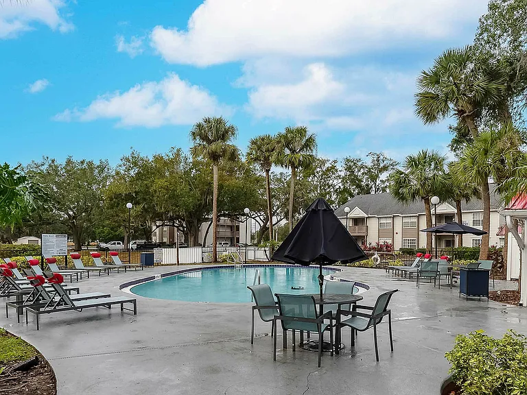 Experience serene poolside living in this lush and inviting community.