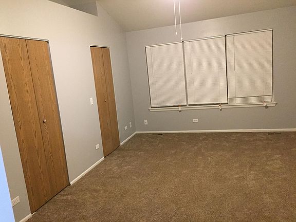 Master bedroom with 2 walk in closets