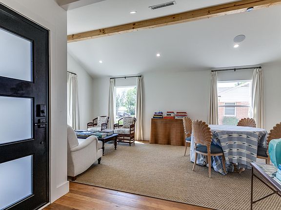 Inside the front door, the expansive living room and dining room