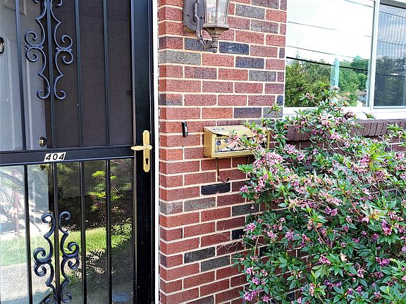 Front entrance to townhome with sturdy storm door