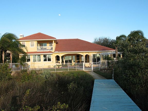rear of house faces water, dock