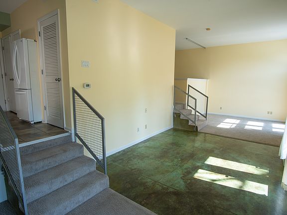 Split-level living area, plenty of wall space and windows