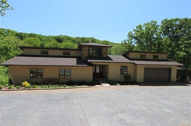 Custom built ranch on one acre and on a private road.